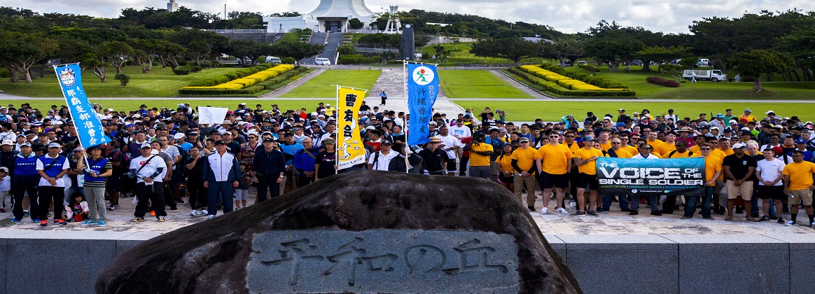 Members of the Japan Self-Defense Force and U.S. military pose for a photo during a cleanup June 15 at Peace Memorial Park, Okinawa, Japan. The cleanup was done in preparation for Okinawa Memorial day, June 23, where many families come to Peace Memorial Park to honor the fallen soldiers from the Battle of Okinawa. (U.S. Marine Corps photo by Pfc. Jacob Foster)